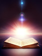 ancient open book with magic light