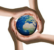 hands of women and the globe
