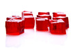 Cubes of red jelly on white background Cubes of red jelly on white background