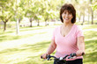 Photo: Senior Hispanic woman with bike Senior Hispanic woman with bike
