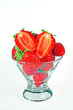 A heap of fresh strawberries in a glass bowl, isolated on white A heap of fresh strawberries in a glass bowl, isolated on white