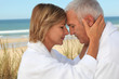 couple of mature people meditating