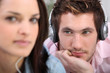 man with headphones beholding his belle