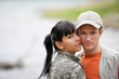 A couple enjoying a day by the lake