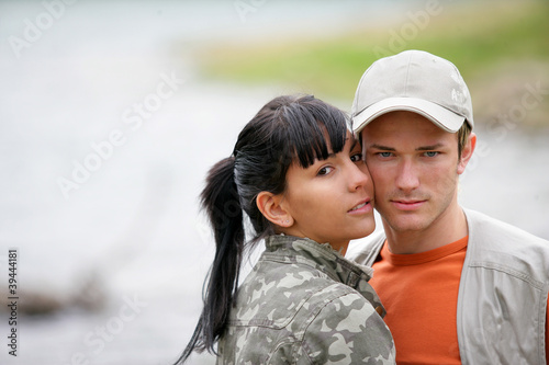 Photo: A couple enjoying a day by the lake A couple enjoying a day by the lake