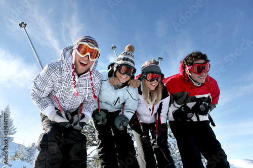 Photo: group of teenagers skiing group of teenagers skiing