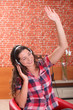 young woman listening and enjoying music