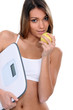 portrait of beautiful Latina eating apple with scales