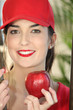 Woman holding red apple