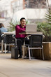 Hispanic Businessman - Telecommuting from Internet Cafe