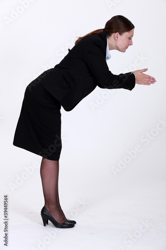 Photo: Black woman stood in a position to dive Black woman stood in a position to dive