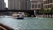 Chicago boat on river with buildings