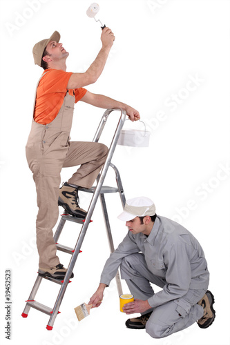 Photo: craftsmen painting together craftsmen painting together