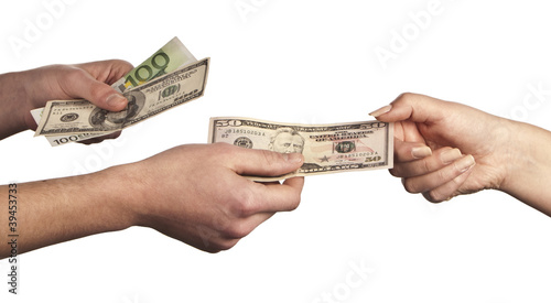 Photo: Hand giving money to other hand Hand giving money to other hand