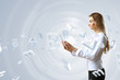 Woman in business wear with technology background