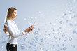 Woman in business wear with technology background