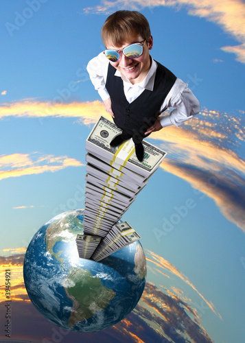 Photo: Young businessman with money symbols Young businessman with money symbols