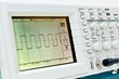 Digital oscilloscope with square wave on the screen