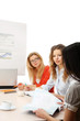 Photo: A group of working women issitting on the table A group of working women issitting on the table