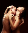 Photo: A passionate couple, isolated on brown A passionate couple, isolated on brown