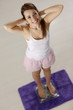 happy woman on scales satisfied for weight loss