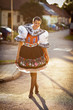 young woman in a richly decorated ceremonial folk dress