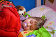 child and dog sleeping