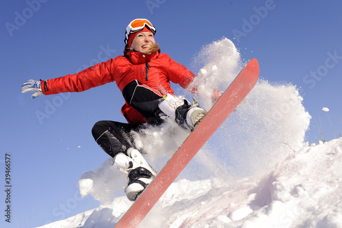 Photo: Young woman on snowboard Young woman on snowboard