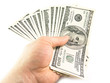 The isolated hundred dollar in a hand