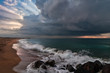 Marine landscape with colorful clouds and wave