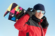Happy sportsman with snowboard