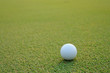 Photo: Golf ball on green grass Golf ball on green grass