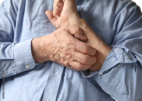 Photo: businessman with an itchy arm businessman with an itchy arm