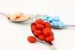 Colorful Pills In Three Spoons