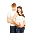 Young loving couple waiting baby isolated on white