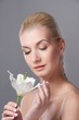 Beautiful blond woman with white lily flower Beautiful blond woman with white lily flower