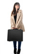 a beautiful girl holds a black suitcase