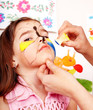 Child with face painting.