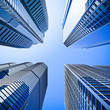 blue highrise glass skyscraper intersection low angle shot