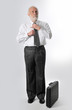 a man fixes his tie