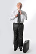 a man fixes his tie