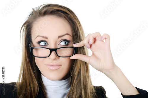 Foto: The business woman in glasses looks sideways isolated The business woman in glasses looks sideways isolated