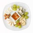 dish of cheese with grapes
