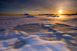 Sunset  in winter evening over the sea coast