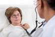 Doctor examining senior patient