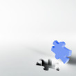 blue puzzle in the corner of white surface blue puzzle in the corner of white surface