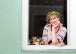 Portrait Happy Ukrainian woman in the window