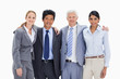 Smiling business team arm in arm