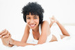 Frizzy haired woman lying on the belly