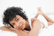 Portrait of a black haired woman listening to music
